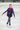 Junior figure skater wearing vest on ice rink